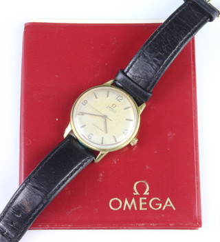A gentleman's gilt cased Omega automatic Seamaster wristwatch on a leather bracelet together with original paper work 