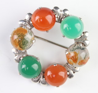 A silver mounted hardstone brooch 