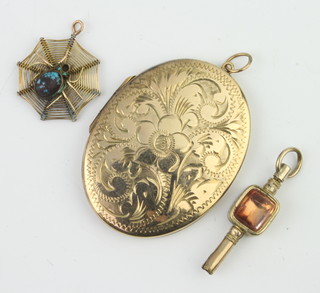 A Victorian watch key with hardstone mounts, locket and pendant 