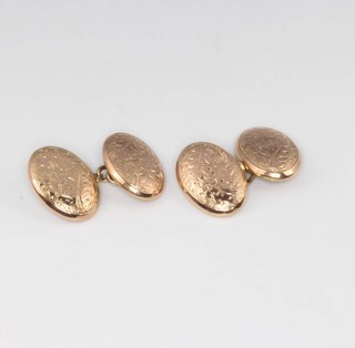 A pair of 9ct yellow gold engraved oval cufflinks 3.6 grams