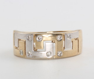 A gentleman's 9ct yellow gold Greek key pattern diamond set ring, size O, 3.4 grams