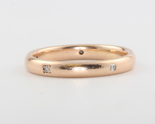 A 9ct yellow gold diamond set band, size M, 2.4 grams