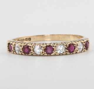 A 9ct yellow gold ruby and diamond ring, size P, 2 grams