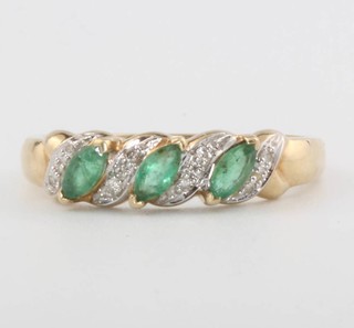 A 9ct yellow gold emerald and diamond ring, size Q, 2.5 grams