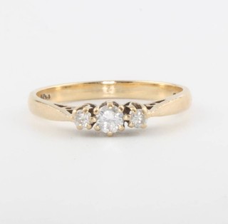 A 9ct yellow gold 3 stone diamond ring, size L 1/2, 1.7 grams
