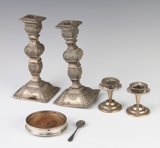 A pair of repousse silver candlesticks (marks rubbed) and minor items 