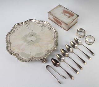Six silver teaspoons, a pair of tongs and 2 napkin rings, 124 grams, a plated salver and cigarette box  