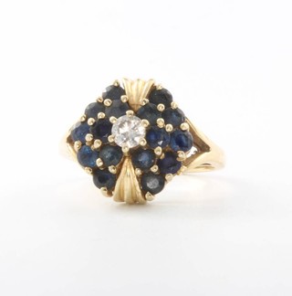 A 14ct yellow gold sapphire and diamond cluster ring 7.1 grams