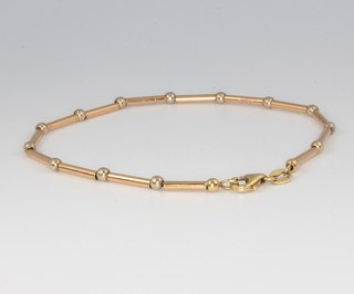 An 18ct yellow and white gold bracelet, 5.5 grams