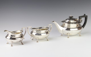 An Art Deco silver panelled 3 piece tea set with ebony mounts Sheffield 1933 and 1929, gross 1200 grams 