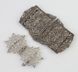 A Victorian pierced silver buckle Birmingham 1899 and a repousse ditto 