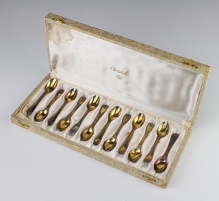 A set of 12 silver gilt coffee spoons 160 grams, cased 