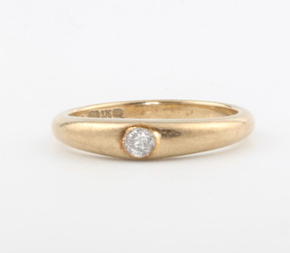 A 9ct yellow gold single stone diamond ring, size K 1/2, 2.5 grams 