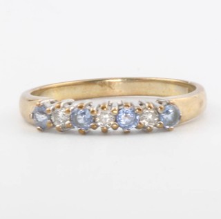 A 9ct yellow gold tanzanite and diamond ring, size L 1/2, 1.8 grams