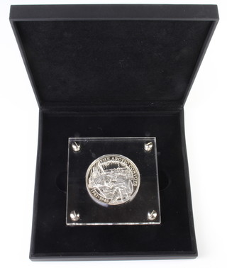 A silver commemorative medallion - The Arctic Convoys 1941-1945 Ten pound coin, dated 2016