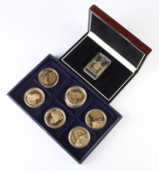 Seven gold plated Winston Churchill commemorative crowns 