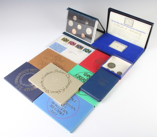 Seven cased, uncirculated coin sets, an FDC, a silver commemorative stamp and minor coins 
