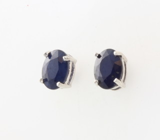 A pair of silver sapphire ear studs 