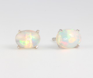 A pair of silver and ethiopian opal ear studs 