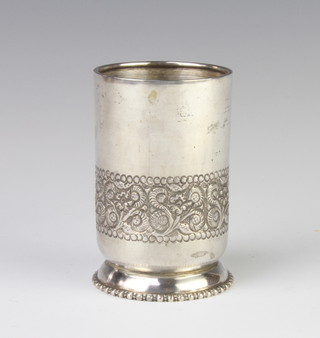 A Continental circular silver vase with repousse decoration 9cm, 123 grams