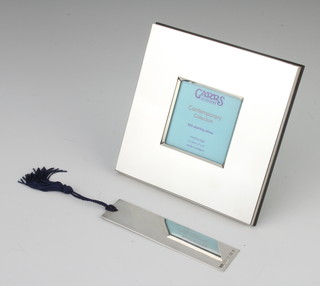 A modern silver square photograph frame 12cm, together with a ditto book mark, 84 grams 