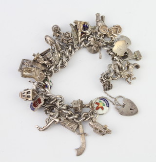 A silver charm bracelet 133 grams
