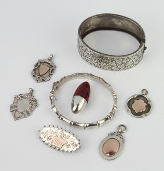 A silver bangle and minor silver jewellery, 82 grams 