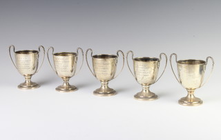 An Edwardian silver sports trophy, London 1909 and 4 others, 442 grams