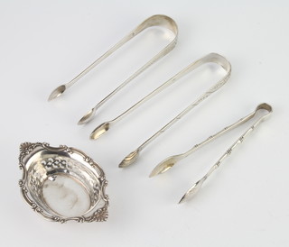 A pair of Georgian silver sugar tongs and minor silver items 128 grams