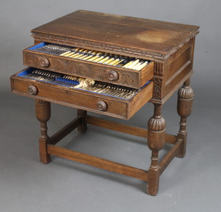 A 1930's oak 2 drawer canteen containing a set of silver plated cutlery for 12 (131 pieces) 