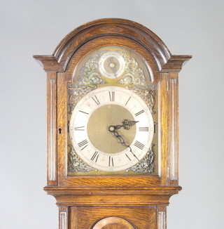 A chiming longcase clock with 25cm arched gilt dial with silvered chapter ring, striking St Michael's Westminster and Whittington Chimes, contained in an oak case with sliding hood 193cm h 