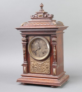 A 19th Century Continental striking bracket clock with silvered dial and Roman numerals contained in an oak and embossed metal case, the back plate marked Lenzkikch Ang.u  