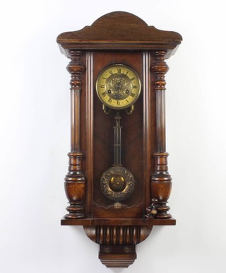 A Vienna style regulator with 14cm embossed gilt and paper dial and grid iron pendulum, contained in a walnut case 