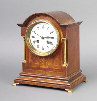 Japy Freres, a French 8 day striking mantel clock with enamelled dial and Roman numerals contained in an arched inlaid mahogany case with gilt metal columns to the side, complete with pendulum and key 