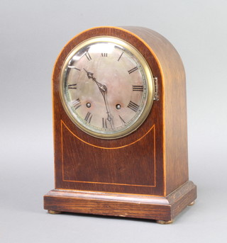 A Winterhalder and Hofmeier striking bracket clock with silvered dial and Roman numerals contained in an arched inlaid oak case, striking on 2 gongs, complete with key and pendulum 