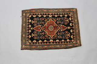 A black and red ground Persian Farahan rug 71cm x 54cm