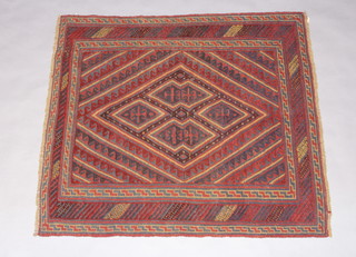 A red and blue ground Gazak rug with diamond medallion to the centre within a multi row border 134cm x 117cm 