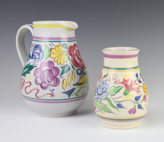 A Poole Pottery jug decorated with stylised birds and flowers 20cm, a baluster vase 15cm and a tapered ditto 10cm 