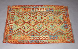 A brown, green and orange ground Chobi Kilim rug 160cm x 104cm 