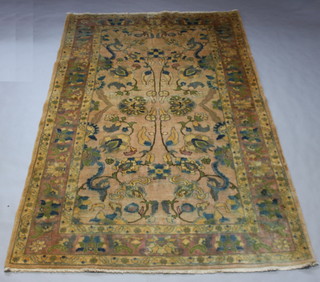 A peach ground and floral patterned Oshak carpet 299cm x 201cm, light flecking in places 