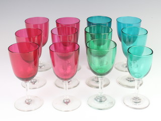 Six Victorian cranberry glass wine glasses and six matched green wines