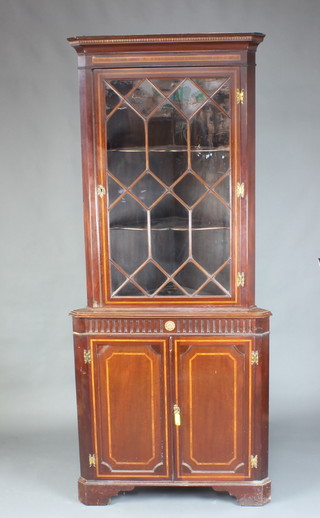 A 19th Century inlaid mahogany double corner cabinet with moulded cornice, fitted shelves enclosed by astragal glazed panelled doors, the base enclosed by panelled doors, raised on bracket feet 104cm h  88cm w x 60cm d 