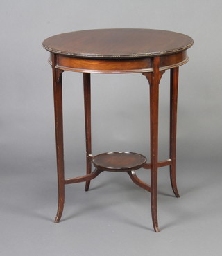 An Edwardian circular mahogany 2 tier occasional table with undertier 71cm h x 60cm w 