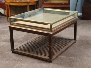 A gilt "bronze" display cabinet raised on a mahogany base with slatted undertier 81cm h x 100cm w x 125cm d  
