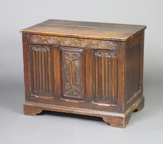 A 1920's oak coffer with linenfold decoration and hinged lid 60cm h x 76cm w x 46cm d 
