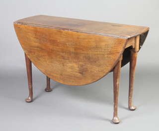 A Georgian mahogany oval pad foot drop flap dining table, 74cm h x  39cm l when closed x 131cm l when open 
