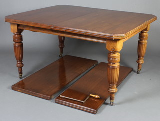 A Victorian mahogany extending dining table raised on turned and fluted supports with 2 extra leaves 75cm h x 140cm l x 234cm l when extended x 120cm w 