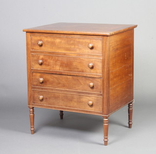 A Georgian mahogany commode in the form of a chest with hinged lid raised on turned supports 75cm h x 64cm w x 51cm d 