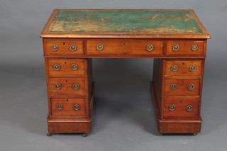 A Victorian mahogany desk with green inset writing surface above 1 long and 8 short drawers 73m h x 106cm w x 66cm d 