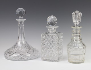 A 19th Century mallet shaped decanter and stopper 26cm, a ships decanter 28cm and a square spirit decanter 23cm 
